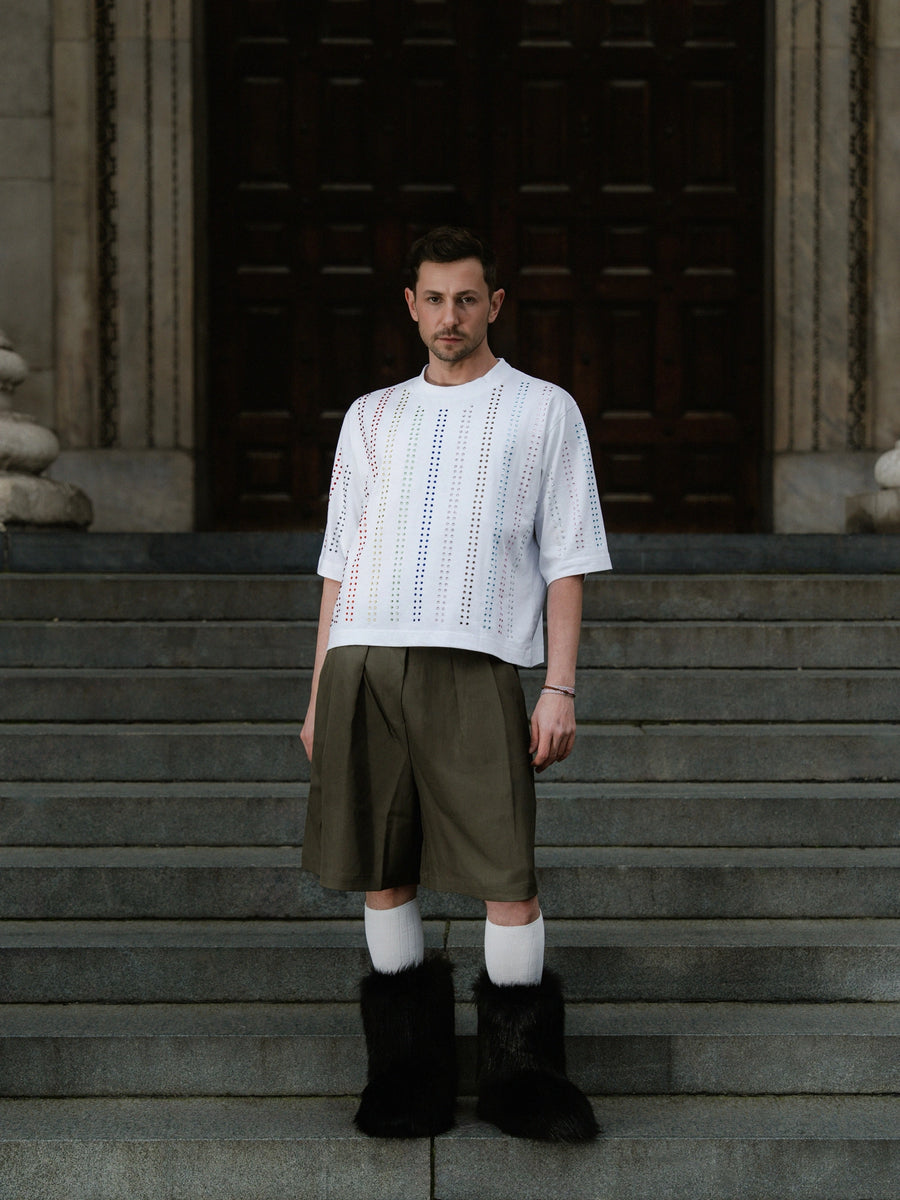White PROUD t-shirt on the cathedral steps before sunrise
