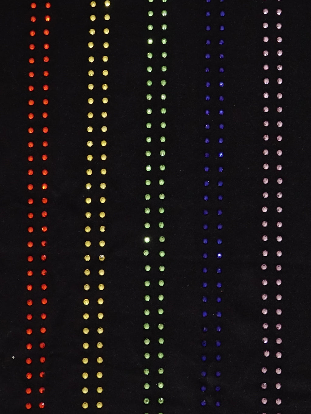 Close-up of a t-shirt embellished with pride motif rhinestones colored on a LGBTQ+ flag Haus of Mx. Proud t-shirt