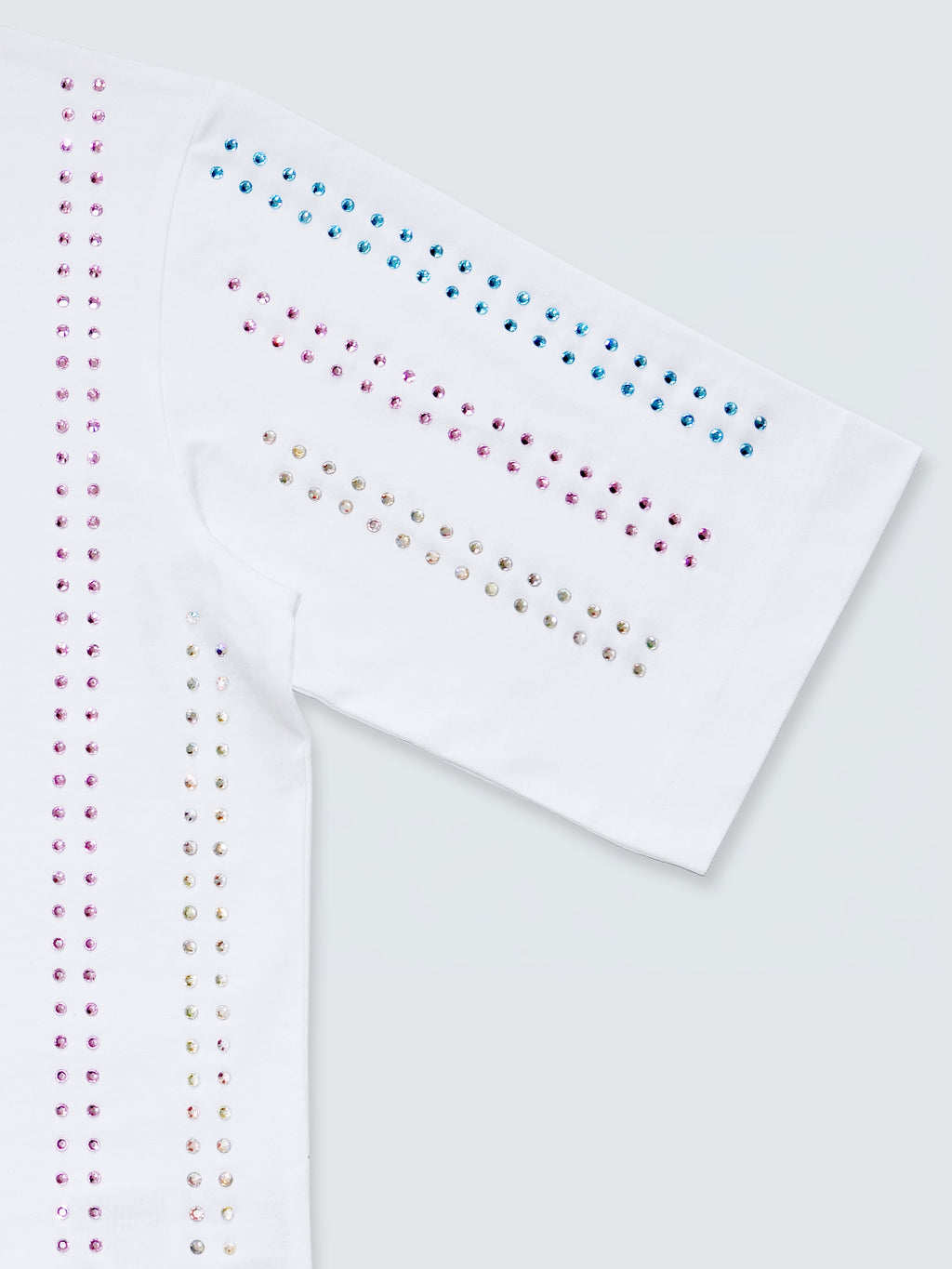 Close-up sleeve detail of white gender-free Proud T-shirt with rainbow crystal embellishment by Haus of Mx.
